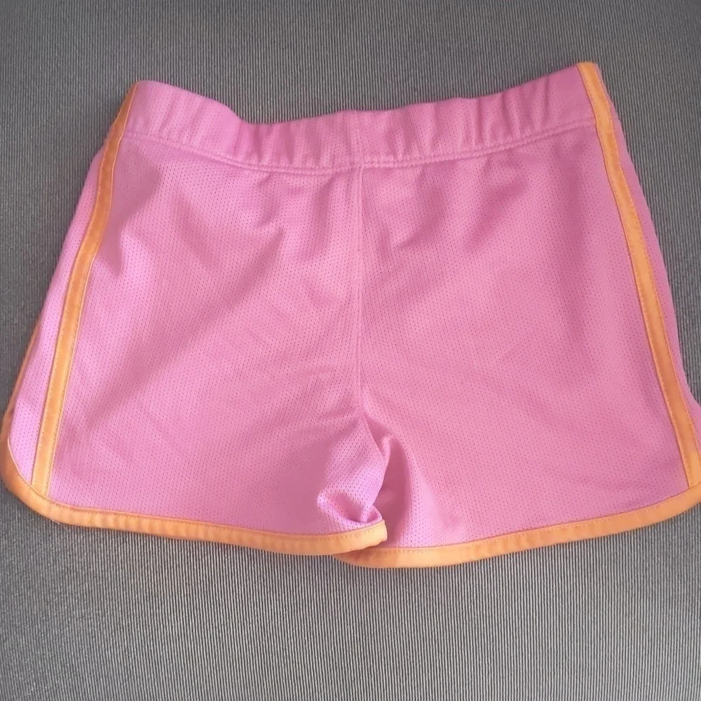 Girl's Adidas shorts size 6. Orange and pink.